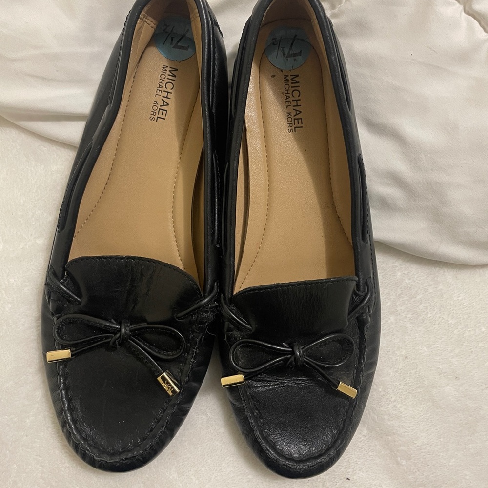 Micheal kor loafers that are black and gold 7.5